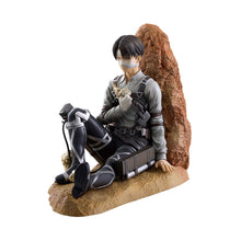 Load image into Gallery viewer, Honour Humanity's Strongest Soldier
Bring one of Attack on Titan's most iconic characters to your collection with this officially licensed Levi Ackerman Ichibansho Figure by Bandai Spirits, inspired by his appearance during the Final Season.
This highly detailed figure presents Levi in a battle-worn seated pose, visibly injured and bandaged following the devastating events of the story. His dark uniform, ODM equipment and distinctive appearance are carefully recreated, while the textured scenic base gives