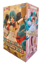 Load image into Gallery viewer, Christmas Comes to Life with Hatsune Miku
Celebrate the festive season with Hatsune Miku in this wonderfully cheerful Christmas 2025 Luminasta Figure by SEGA.
This seasonal version of the world-famous virtual singer gives Miku a charming Christmas makeover, featuring a beautifully detailed festive outfit with warm cream, red and brown tones. Her unmistakable turquoise twin-tails sweep dramatically around the figure, decorated with white accents that add even more character to the Christmas design.
Miku is