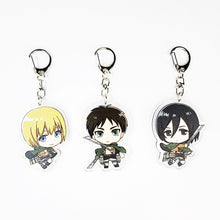 Load image into Gallery viewer, Cool set of Attack On Titan keychains. Premium design DTG quality acrylic keyrings. The main acrylic panel stands at 6cm (approx), and 4mm (approx) thickness. 3 piece set and packaged in a cute see-through pouch. Keychain 1: Armin Arlert Keychain 2: Eren Yeager Keychain 3: Mikasa Ackerman