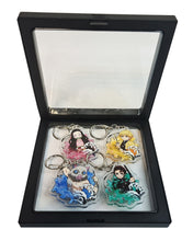 Load image into Gallery viewer, Free UK Royal Mail 24hr delivery Cool set of Demon Slayer keychains. Premium design DTG quality acrylic keyrings. The main acrylic panel stands at 6cm (approx), and 4mm (approx) thickness. 4 piece set, and packaged in a cute see-through pouch. Keychain 1: Zenitsu Agatsuma Keychain 2: Nezuko Kamado Keychain 3: Tanjiro Kamado Keychain 4: Inosuke Hashibira