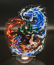 Load image into Gallery viewer, Free Royal Mail 24hr delivery Striking Demon Slayer anime acrylic stand of the brother and sister duo (Tanjiro and Nezuko Kamado) from the popular anime series Demon Slayer. High-quality DTG print design showing Tanjiro and Nezuko posing in battle mode. Height: 11.5cm x 15.5cm Thickness: 3mm Excellent gift for any Demon Slayer fan.