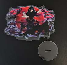 Load image into Gallery viewer, Free Royal Mail 24hr delivery. Beautiful Acrylic stand of Itachi Uchiha from the popular anime series Naruto. High-quality DTG print design showing the main Character Itachi Uchiha posing in battle mode. Height: 12.5cm x 15cm Thickness: 3mm Excellent gift for any Naruto fan.