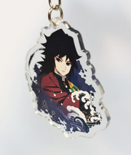 Load image into Gallery viewer, Cool set of Demon Slayer keychains - Hashiras Premium design DTG quality acrylic keyrings. The main acrylic panel stands at 6cm (approx), and 4mm (approx) thickness. 3 piece set, and packaged in a window display gift box. Keychain 1: Sanemi Shinazugawa Keychain 2: Giyu Tomioka Keychain 3: Gyomei Himejima Excellent gift for any Demon Slayer fan.