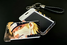 Load image into Gallery viewer, Free UK Royal Mail 24hr delivery Beautiful crafted Naruto Card holder with keyring. DTG high quality design of Naruto Uzumaki is adapted from the popular anime Naruto. The card holder is made of High-quality PVC plastic with a smooth matt finish. The card holder can be used for storing bank cards/student cards/and other ID cards. Premium leather rope keyring is also included. Excellent gift for any Naruto fan. Size: Size: 6.7cm x 11cm (Approx) Can store up to three regular size credit cards.