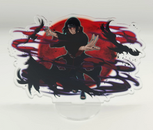 Load image into Gallery viewer, Free Royal Mail 24hr delivery. Beautiful Acrylic stand of Itachi Uchiha from the popular anime series Naruto. High-quality DTG print design showing the main Character Itachi Uchiha posing in battle mode. Height: 12.5cm x 15cm Thickness: 3mm Excellent gift for any Naruto fan.