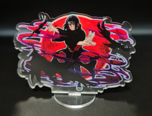 Load image into Gallery viewer, Free Royal Mail 24hr delivery. Beautiful Acrylic stand of Itachi Uchiha from the popular anime series Naruto. High-quality DTG print design showing the main Character Itachi Uchiha posing in battle mode. Height: 12.5cm x 15cm Thickness: 3mm Excellent gift for any Naruto fan.