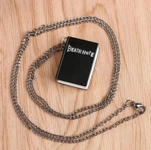 Load image into Gallery viewer, Free UK Royal Mail Tracked 24hr delivery 

Beautiful design of Death Note Mini Clock Pendant Necklace. 

The Pendant is designed beautifully with the logo engraved into the front of the pendant. The front panel opens and reveals a beautiful analogue mini clock inside, and the Death Note message on the clock. - Adapted beautifully, direct from the anime. 

Material: Metallic stainless steel

Size: 4cm x 3cm x 1.5cm (Pendant) / 40cm (Necklace chain) 

Packaged in a window display gift box. 

Excellent gift fo
