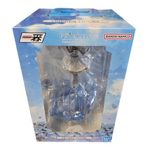 Load image into Gallery viewer, Bring the Magic of Frieren to Your Collection

Celebrate one of modern anime's most beloved fantasy characters with this officially licensed Frieren Ichibansho Figure by Bandai Spirits from Frieren: Beyond Journey's End.

Standing an impressive approximately 27cm tall, Frieren is captured in a graceful action pose wielding her staff, surrounded by flowing translucent blue effects that give the figure a wonderful sense of movement and magic.

Her distinctive white and gold outfit, long silver hair and beauti
