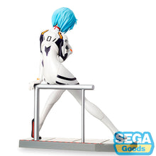 Load image into Gallery viewer, THE QUIET STRENGTH OF REI AYANAMI
Bring one of anime's most recognisable characters to your collection with this officially licensed Rei Ayanami LPM Figure by SEGA, inspired by Rebuild of Evangelion / Evangelion: New Theatrical Edition.

Rei is captured in a calm seated pose wearing her unmistakable white Evangelion plugsuit, complete with its black, red, green and orange detailing. Her short pale-blue hair and distinctive red eyes immediately recreate the appearance that has made the EVA Unit-00 pilot one 
